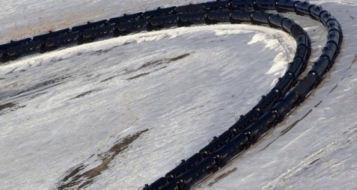 A aerial image shows a train entering a depot along the Burlington Northern Santa Fe (BNSF) rail line outside of Williston, North Dakota March 12, 2013. REUTERS/Shannon Stapleton via NewsCred