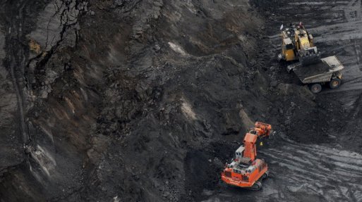 An excavator loads a truck with oil sands at the Suncor mine near the town of Fort McMurray in Alberta, Canada in 2009. Environmental groups that oppose oil sands mining have pointed to delayed and canceled projects as a sign of recent success. Mark Ralston/AFP/Getty Images