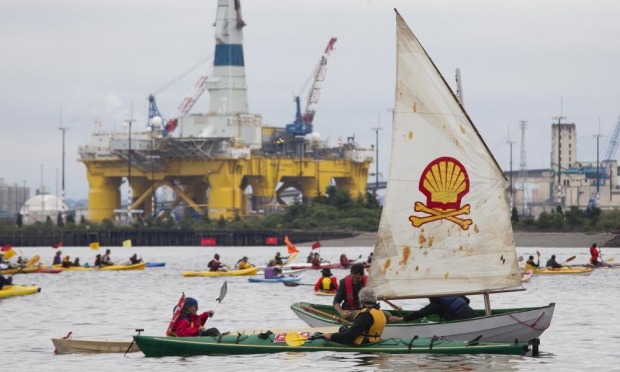  ‘Shell No’ protesters take to the water on Saturday heading near Royal Dutch Shell’s Polar Pioneer drilling rig near Seattle. Photograph: David Ryder/Getty Images